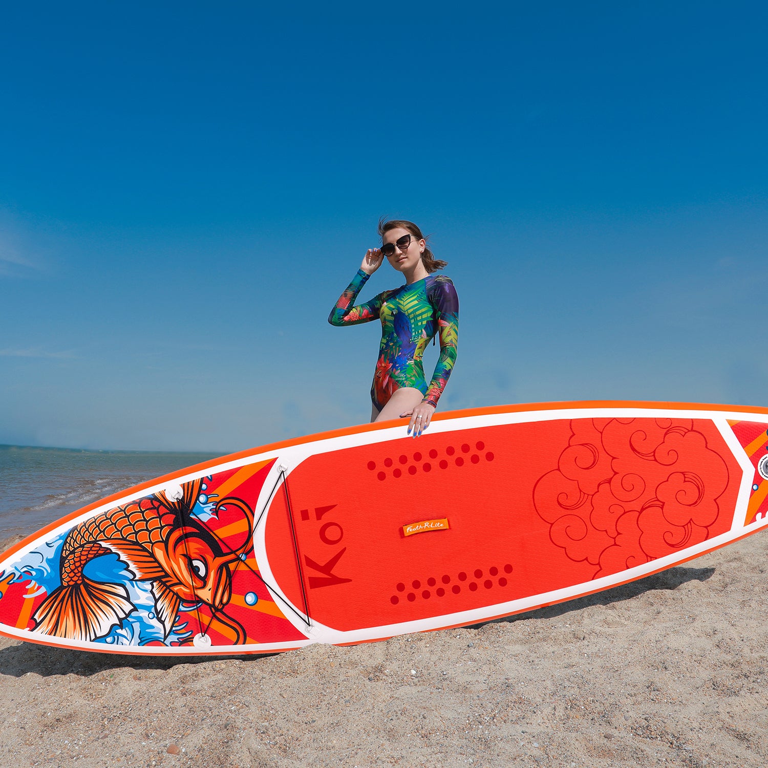 A woman was standing with Funwater inflatable SUP KOI