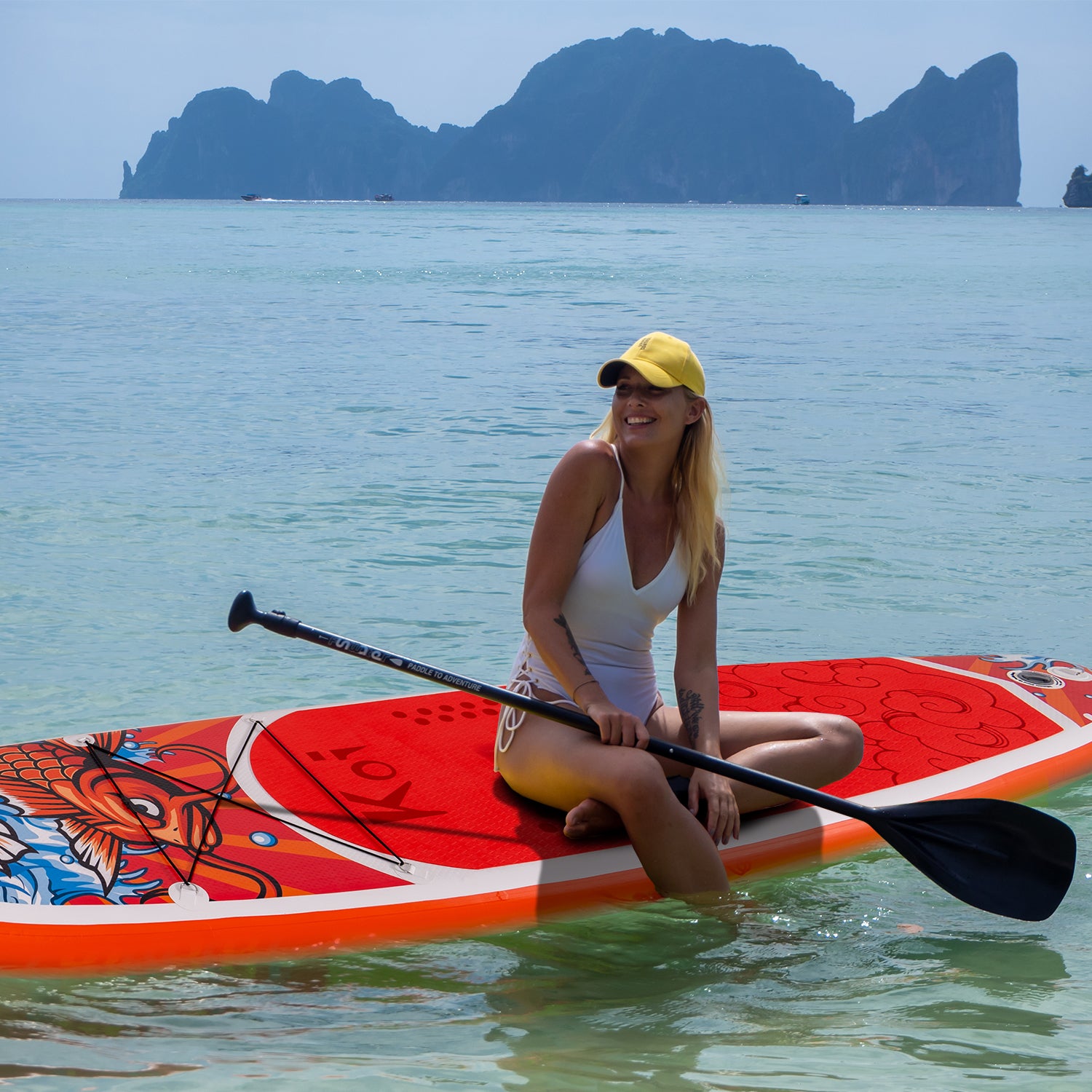 A woman was sitting on Funwater inflatable paddle board KOI on the water